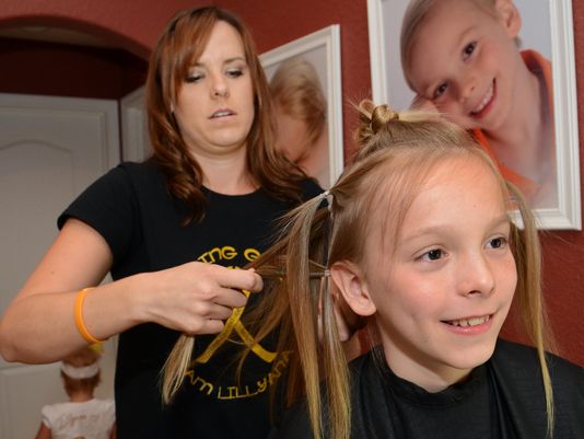 Tot's cancer inspires Fla. boy to grow, donate hair 