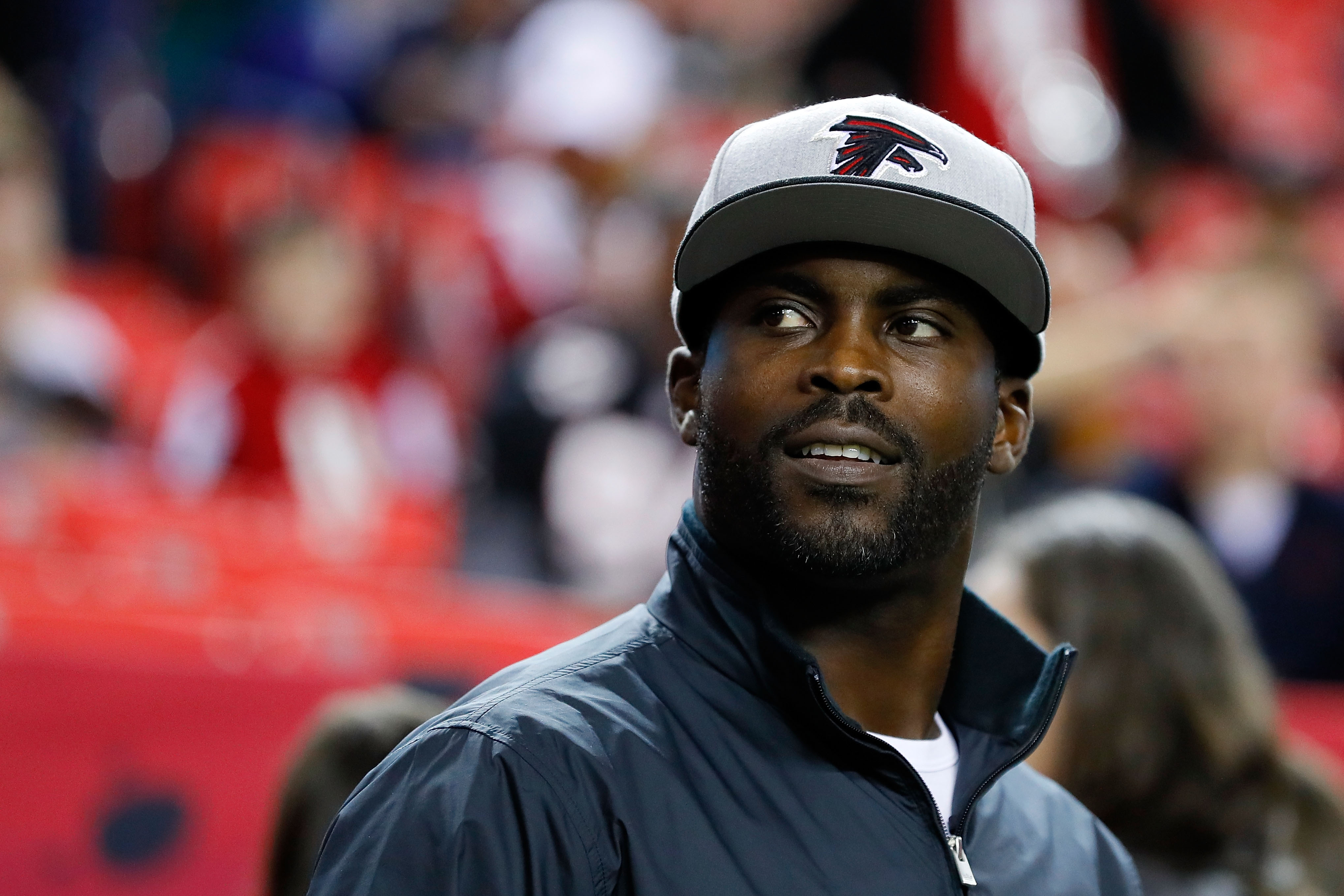 Atlanta Falcons quarterback Michael Vick walks off the field after